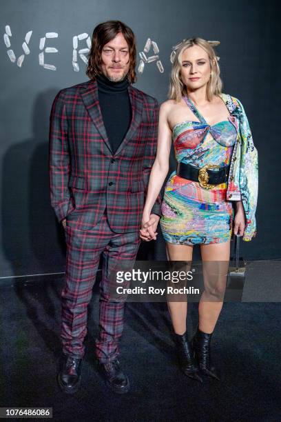 Norman Reedus and Diane Kruger attend the the Versace fall 2019 fashion show at the American Stock Exchange Building in lower Manhattan on December...