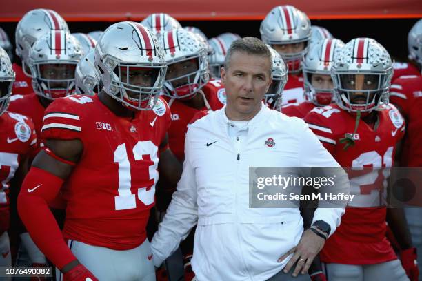 Ohio State Buckeyes head coach Urban Meyer and Rashod Berry of the Ohio State Buckeyes look on from the sideline during the first half in the Rose...