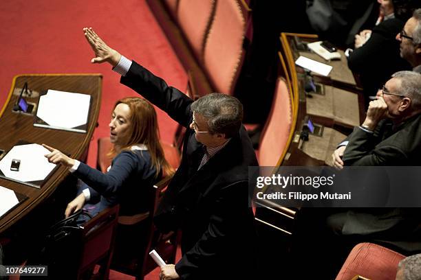 Centre - left wing Italian senator holds arm in a fascist gesture at the Italian Senate Chamber on December 13, 2010 in Rome, Italy. Italian Prime...