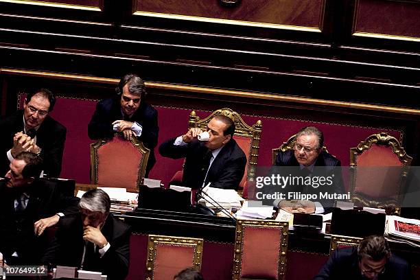 Italian Prime Minister Silvio Berlusconi drinks an espresso at the Italian Senate Chamber on December 13, 2010 in Rome, Italy. Italian Prime Minister...