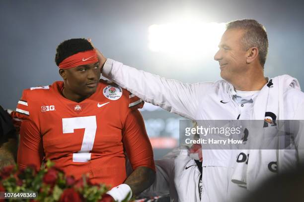 Dwayne Haskins of the Ohio State Buckeyes and Ohio State Buckeyes head coach Urban Meyer celebrate after winning the Rose Bowl Game presented by...