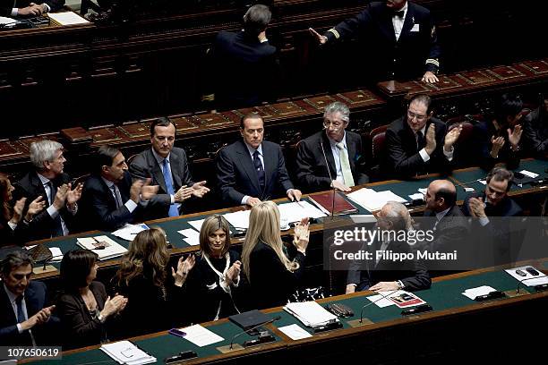 Members of the Italian Government cheer Prime Minister Silvio Berlusconi, during a session on the confidence vote to Berlusconi's government at the...