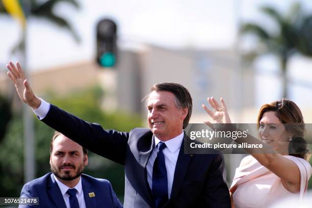 January 2019, Brazil, Brasilia: Brazil's designated President Jair Bolsonaro waves as he and his wife Michelle drive through the capital Brasilia in...