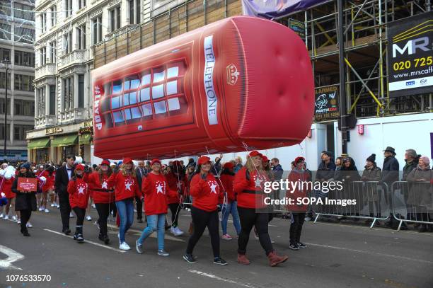 Blow up phone box is part of the parade during London's New Year's Day parade. Bands dancers, cars, bikes and around 8,000 performers took part.