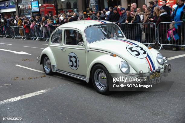 Beetle vintage vehicle takes part in a parade during London's New Year's Day parade. Bands dancers, cars, bikes and around 8,000 performers took part.