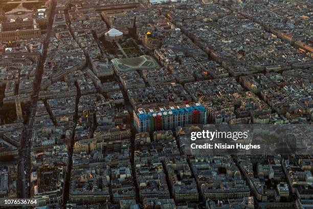 aerial flying over le centre pompidou in paris france, sunset - pompidou center stock-fotos und bilder