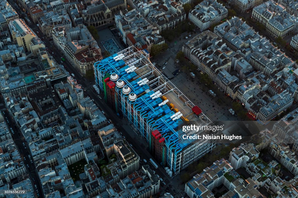 Aerial flying over Paris France with view of Le Centre Pompidou at sunset