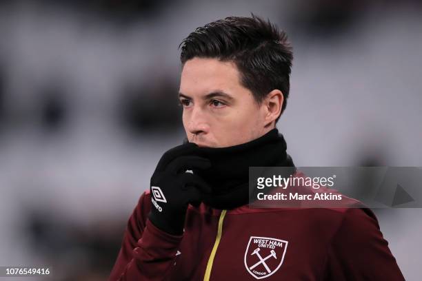 Samir Nasri of West Ham United looks on during the warm up prior to the Premier League match between West Ham United and Brighton & Hove Albion at...