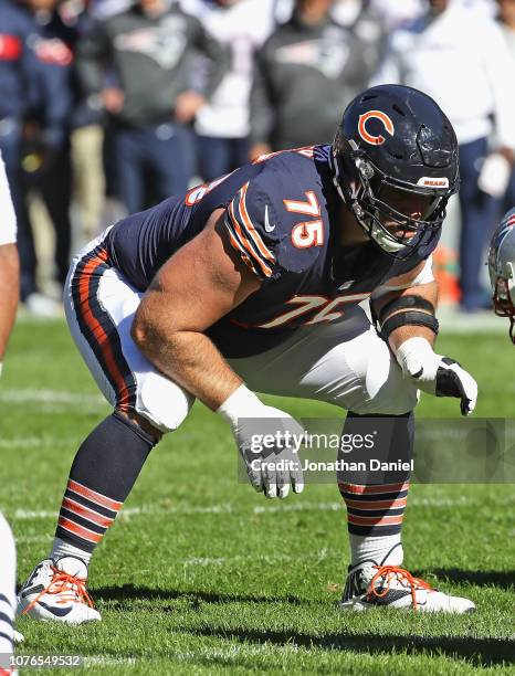 Kyle Long of the Chicago Bears awaits the snap against the New England Patriots at Soldier Field on October 21, 2018 in Chicago, Illinois. The...