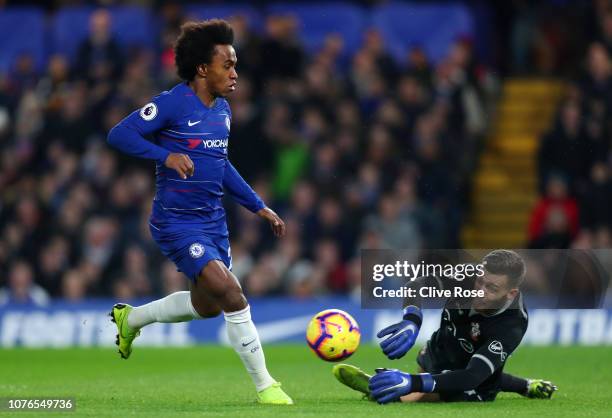 Willian of Chelsea in action against Angus Gunn of Southampton during the Premier League match between Chelsea FC and Southampton FC at Stamford...