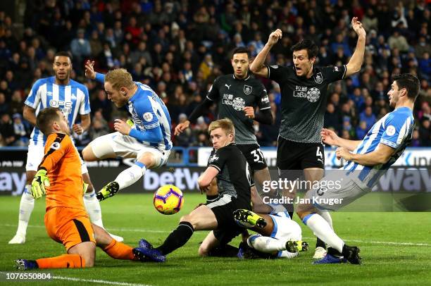 Goal mouth scramble including Christopher Schindler of Huddersfield Town, Ben Mee and Thomas Heaton of Burnley during the Premier League match...