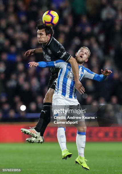 Burnley's Jack Cork competing with Huddersfield Town's Alex Pritchard during the Premier League match between Huddersfield Town and Burnley FC at...