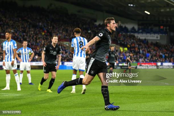 Chris Wood of Burnley celebrates after scoring his sides first goal during the Premier League match between Huddersfield Town and Burnley FC at John...