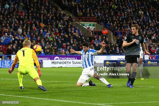 Chris Wood of Burnley scores his sides first goal past Jonas Lossl of Huddersfield Town during the Premier League match between Huddersfield Town and...