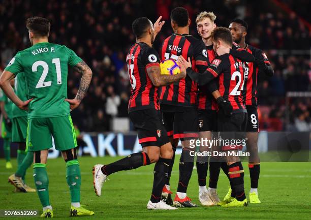 Ryan Fraser of AFC Bournemouth celebrates scores his team's third goal with team mates during the Premier League match between AFC Bournemouth and...