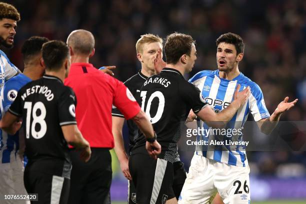 Christopher Schindler of Huddersfield Town argues with the referee after being shown a red card during the Premier League match between Huddersfield...