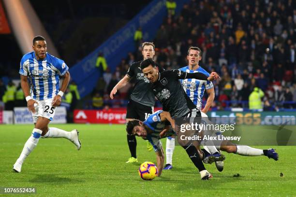 Christopher Schindler of Huddersfield Town is sent of following this tackle on Dwight McNeil of Burnley during the Premier League match between...