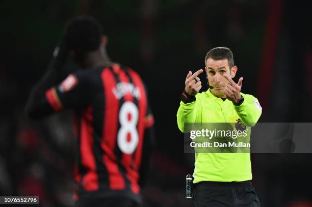 Referee David Coote signals to Jefferson Lerma of AFC Bournemouth during the Premier League match between AFC Bournemouth and Watford FC at Vitality...