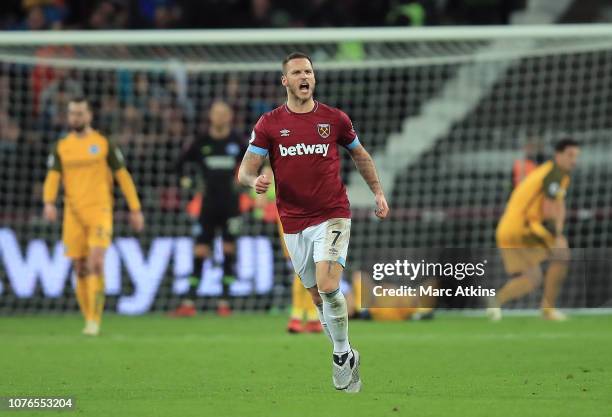 Marko Arnautovic of West Ham United celebrates after scoring his team's second goal during the Premier League match between West Ham United and...