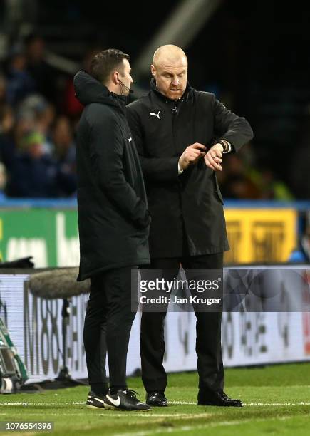 Sean Dyche, Manager of Burnley gestures towards his watch during the Premier League match between Huddersfield Town and Burnley FC at John Smith's...