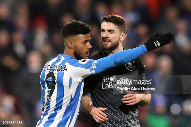 Elias Kachunga of Huddersfield Town gestures towards the touchline as Robbie Brady of Burnley is shown a red card during the Premier League match...