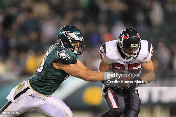 Linebacker Stewart Bradley of the Philadelphia Eagles covers tight end Joel Dreessen of the Houston Texans during a game at Lincoln Financial Field...