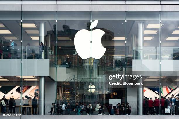 The Apple Inc. Logo is displayed at one of the company's stores in Hong Kong, China, on Thursday, Jan. 3, 2019. Apple cut its revenue outlook for the...