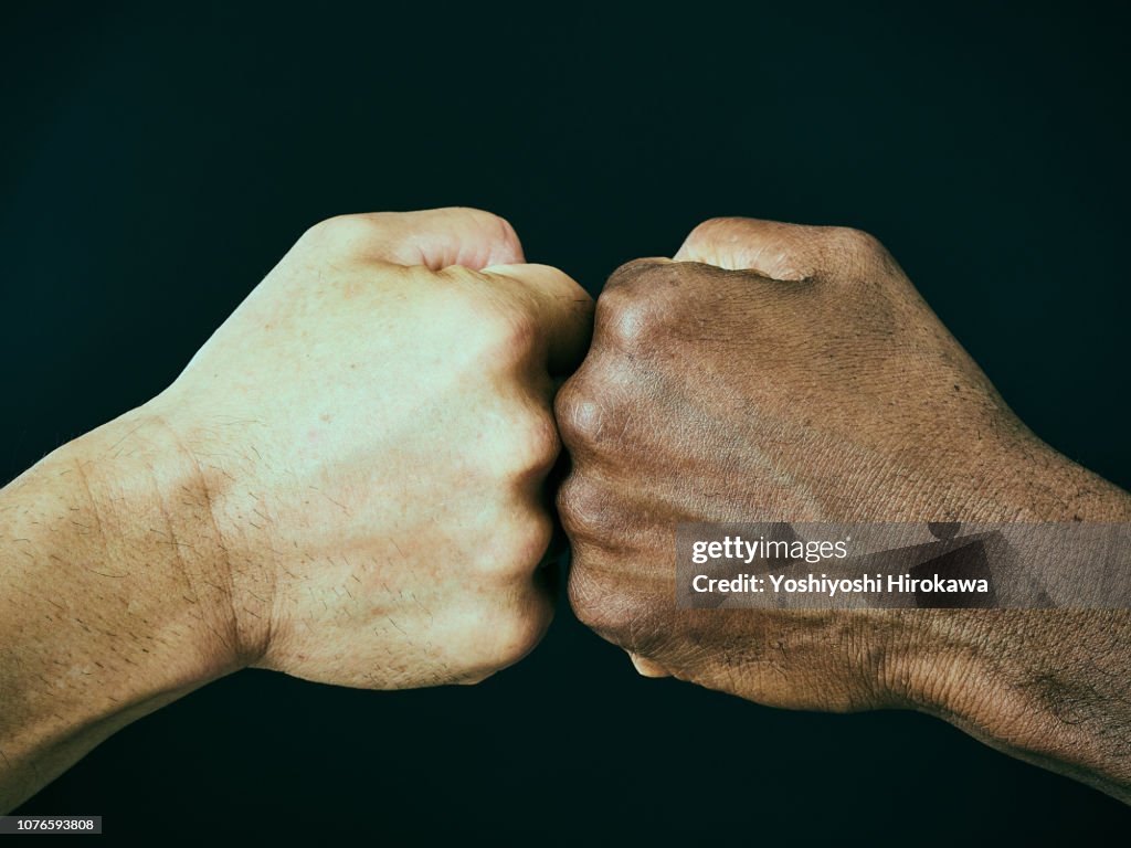 American and a Japanese Bumping Fists