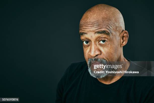 portrait of attractive senior african american. - ziegenbart stock-fotos und bilder