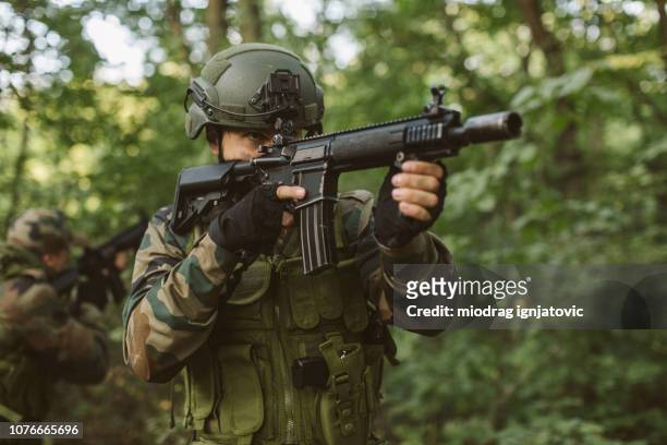 soldiers having military training - woodland camo stock pictures, royalty-free photos & images