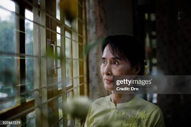 Myanmar democracy icon Aung San Suu Kyi poses for a portrait at the National League for Democracy headquarters in Yangon on December 8, 2010 in...