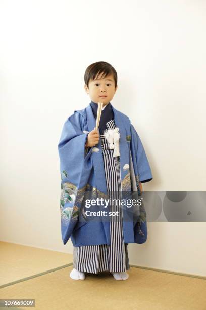 boy standing in traditional costume in the room - shichi go san stock pictures, royalty-free photos & images