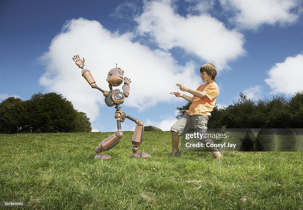 Young boy with robot companion