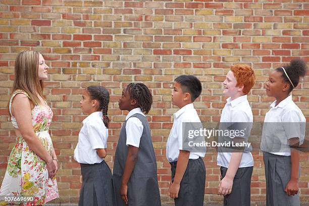 school children lining up - braiding hair stock pictures, royalty-free photos & images