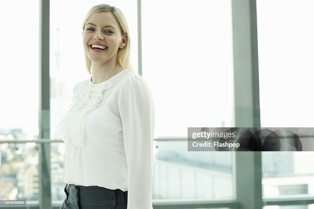 Portrait of business woman smiling to camera