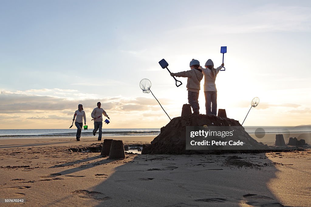 Family on beach in winter