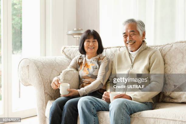 senior couple smiling - japanese senior couple bildbanksfoton och bilder