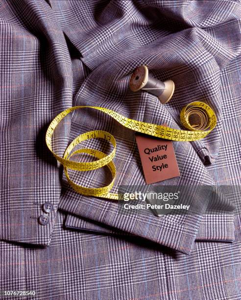 tailor's needle and thread on suit jacket - bespoke stock pictures, royalty-free photos & images