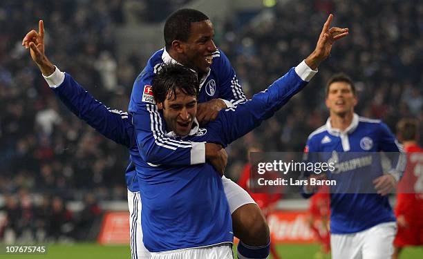 Raul Gonzalez of Schalke celebrates with team mate Jefferson Farfan after scoring his teams first goal during the Bundesliga match between FC Schalke...