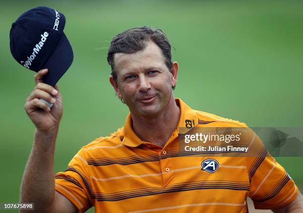 Retief Goosen of South Africa thanks the support after scoring a birdie on the last hole during round two of the South African Open Golf Championship...