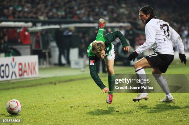 Marko Marin of Bremen and Alexander Bugera of Kaiserslautern battle for the ball during the Bundesliga match between SV Werder Bremen and 1. FC...