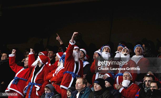 Crystal Palace fans dressed in Santa costumes brave the freezing temperatures during the npower Championship match between Nottingham Forest and...