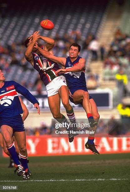 Brett Montgomery of the Western Bulldogs battles with Ashley Prescott of Fremantle during the AFL Round 12 match played at the Optus Oval in...