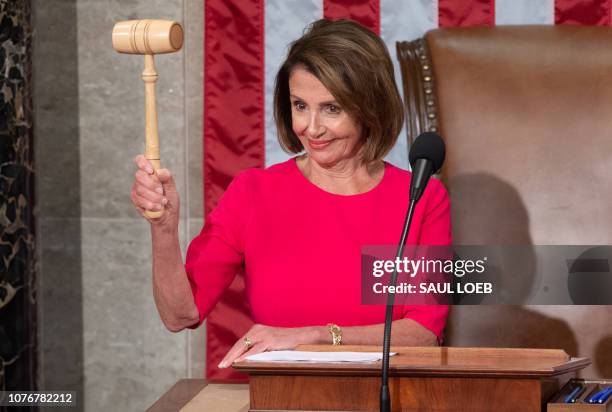 Incoming Speaker of the House Nancy Pelosi holds her gavel after being elected during the beginning of the 116th US Congress at the US Capitol in...