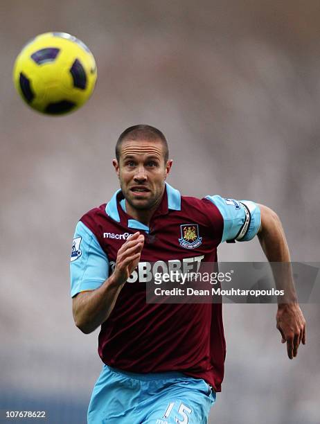 Matthew Upson of West Ham chases the lose ball during the Barclays Premier League match between Blackburn Rovers and West Ham United at Ewood park on...