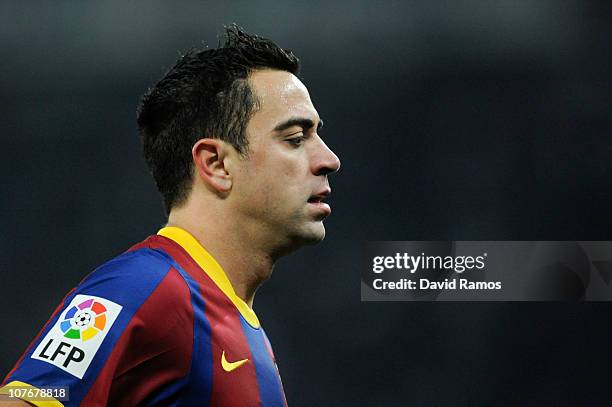 Xavi Hernandez of Barcelona looks on during the La Liga match between Espanyol and Barcelona at Cornella - El Prat stadium on December 18, 2010 in...