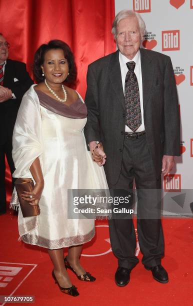 Karlheinz Boehm and his wife Almaz Boehm attend the 'Ein Herz Fuer Kinder' charity gala at Axel Springer Haus on December 18, 2010 in Berlin, Germany.
