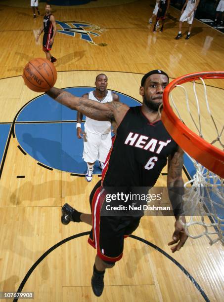 LeBron James of the Miami Heat dunks against Andray Blatche of the Washington Wizards at the Verizon Center on December 18, 2010 in Washington, DC....