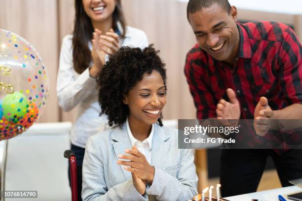 business colleagues celebrating birthday party at work - work anniversary stock pictures, royalty-free photos & images