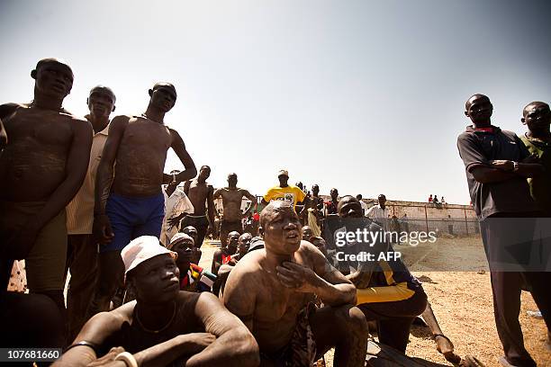 Members of the Mundari tribe from Central Equatoria attend the final of Sudan's first commercial wrestling league between the Mundari tribe and the...